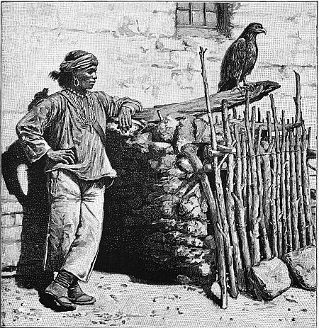 A PUEBLO INDIAN BESIDE AN EAGLE-CAGE